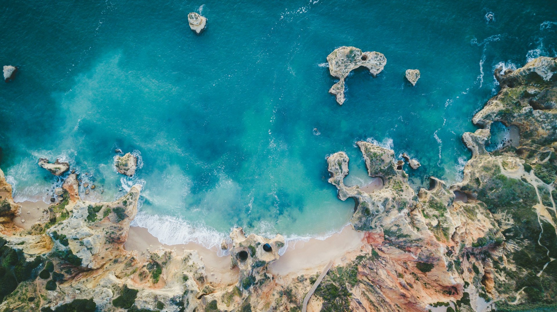 Praia do Camilo - Photo Credit: Photo by Claudio Schwarz on Unsplash