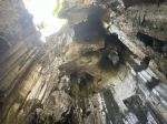 Sunlight enters through an opening above the weathered limestone formations inside the Sawa-i-Lau Caves in Fiji’s Yasawa Islands. - Photo Credit: Wendy Harman