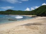 A quiet sandy cove and clear tropical water along the coastline of Waya Island. - Photo Credit: Miguel Sanchez
