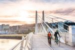 Cycling on Tilikum Bridge - Photo Credit: Photo by Cole Keister on Unsplash