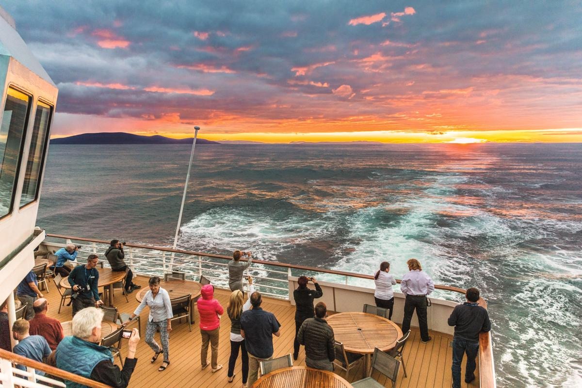 Gathering on deck at sunset