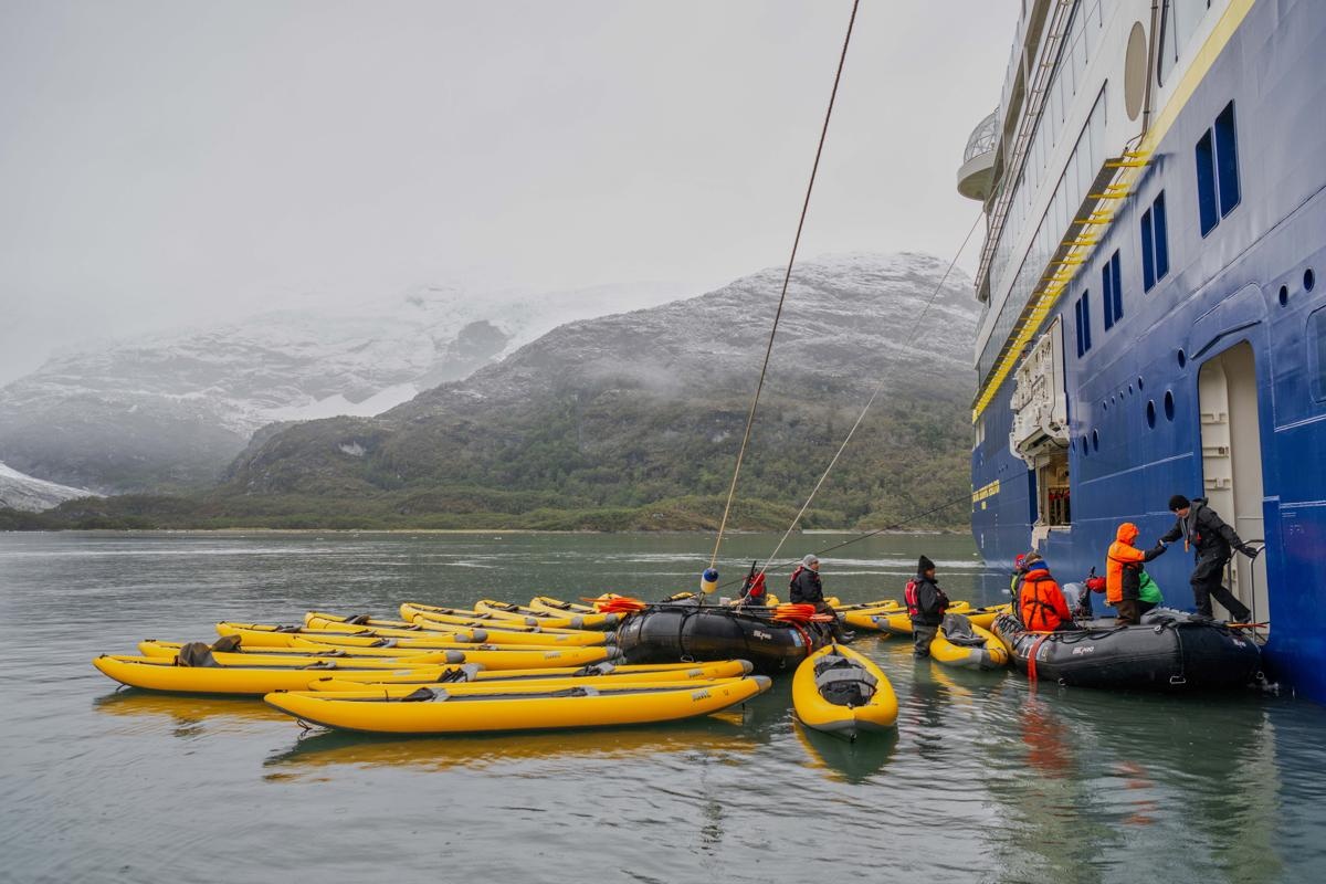 Kayaks alongside the ship