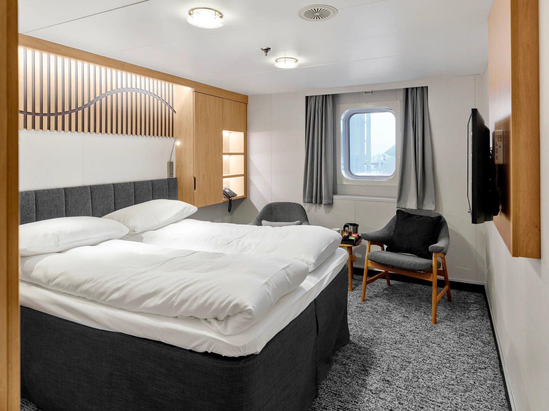 Large double on middle or promenade deck with window (restricted view)
